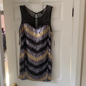 Women’s black and gold sequin dress